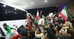 Iran's national soccer team receives subdued welcome home