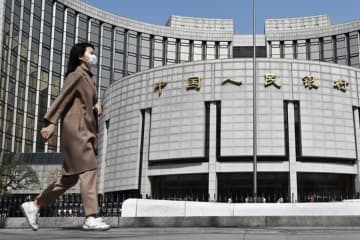中国人民銀、預金準備率を0．5ポイント引き下げ
