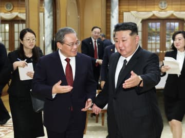 李強氏、金正恩氏と会談