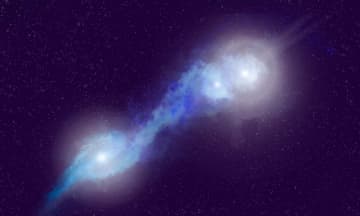 合体しつつある3つの銀河と活発なブラックホール　12億光年先の相互作用銀河を電波で観測