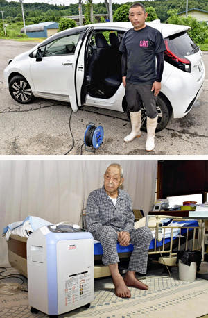 （写真上）ハイブリッド車を使い東條さんの危機を救った高橋さん。「力になれて良かった」と振り返った（写真下）停電後、ハイブリッド車からの電源で稼働した酸素吸入器。東條さんは安心して朝を迎えることができた