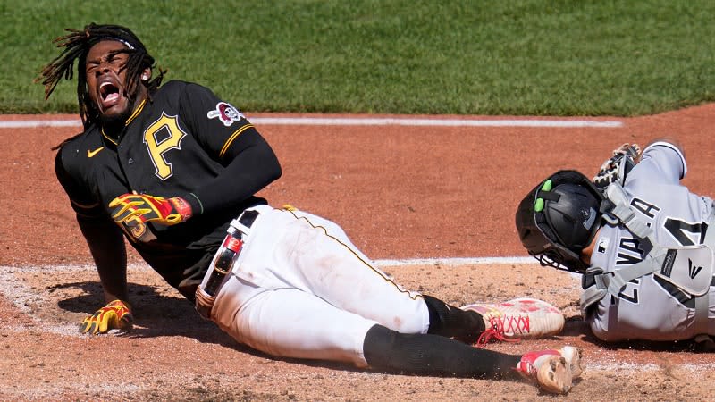 Pirates' O'Neal Cruz fractures left ankle on cross play at home plate