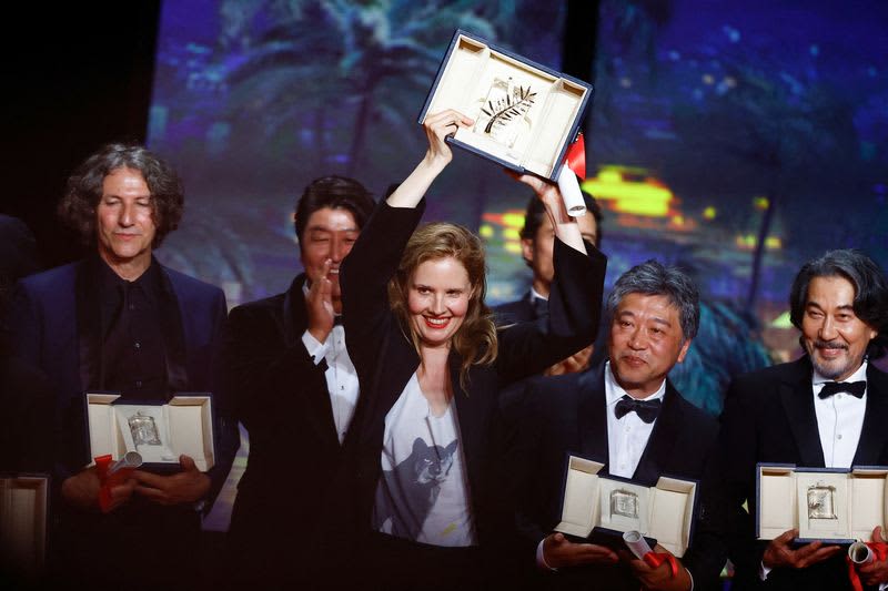 France's Triet is the third woman to win the Cannes Grand Prize, and Japan's Yakusho Koji wins the Best Actor Award.