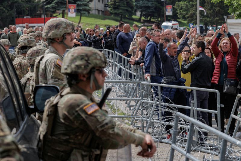 Serbian demonstrators clash with police in Kosovo, NATO forces quell