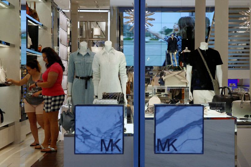 Michael Kors parent cuts sales forecasts as U.S. demand slows