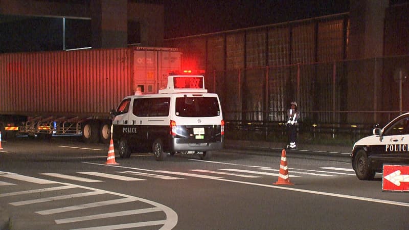 A man on a bicycle was hit by a large trailer at a national highway intersection and died after hitting his head hard.