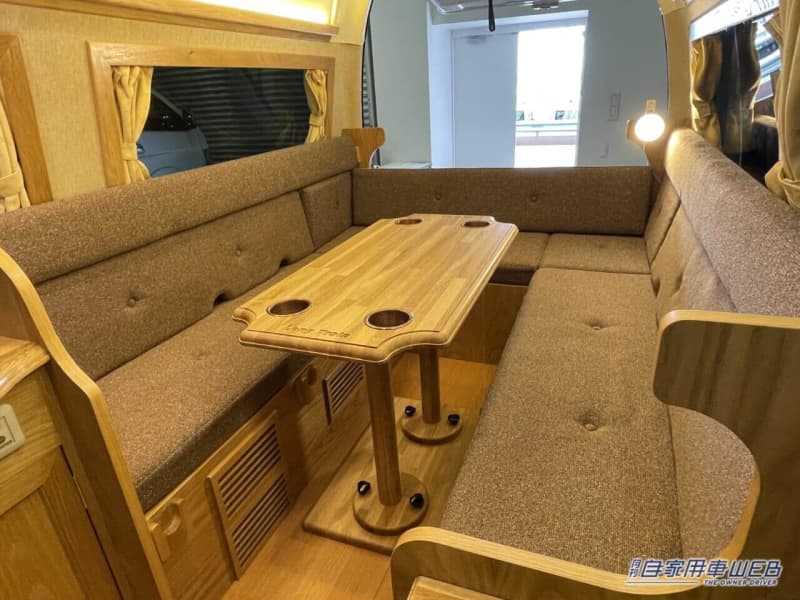 It looks like a living room with plenty of wood!Camper based on Toyota Hiace