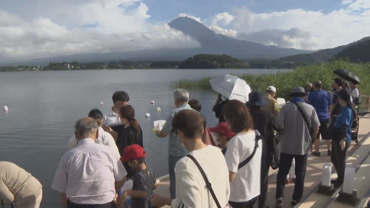 Floating Lanterns with Messages Traditional Okuribon event Lake Kawaguchi overlooking Mt. Fuji