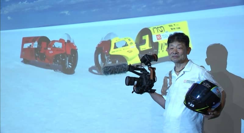 Film director Chikakane holds a press conference in preparation for participating in international motorcycle competitions, aiming to break the world's fastest self-record