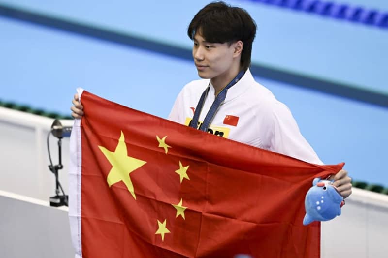 アジア競技大会開会式、中国代表団の旗手は水泳の覃海洋とバスケの楊力維