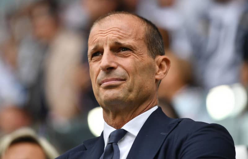 Juventus could be in the interim lead, but manager emphasizes a top-four finish: ``We have to play in the Champions League next season.''