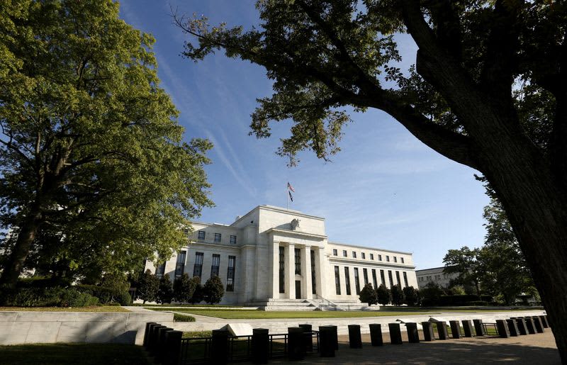 Fed officials signal end of rate hike cycle as price rises slow