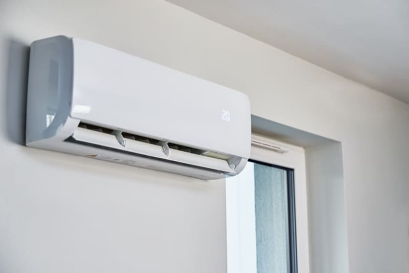 It's cold and I end up using the air conditioner for heating a lot, but how can I save money on air conditioning heating costs?