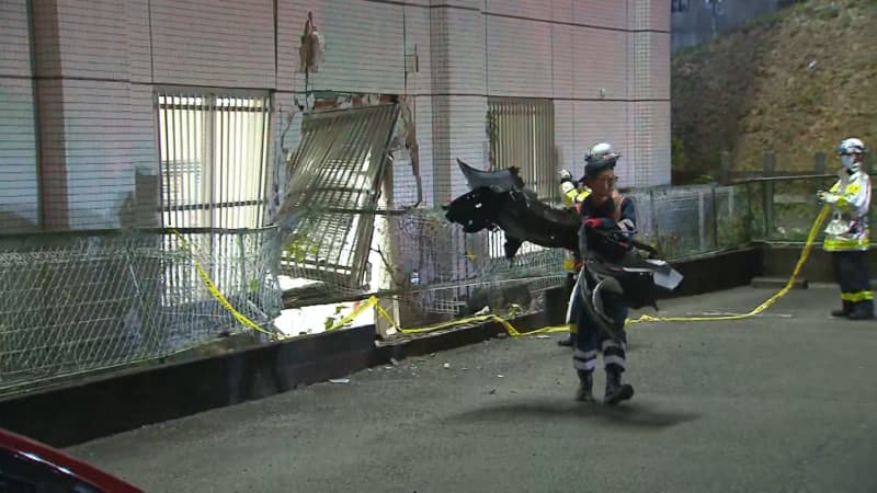 A car carrying an elderly man and woman crashes into the preparatory school Kawaijuku, injuring a teacher and three part-time workers in Yokohama.
