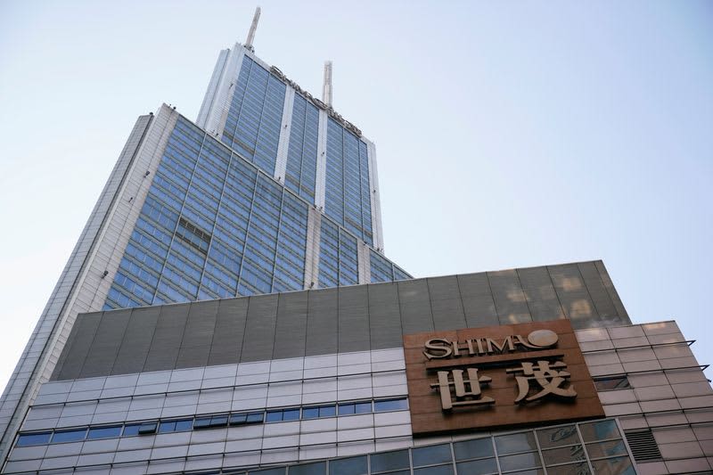 Chinese real estate developer Shimao Group announces debt restructuring plan, stock price flat