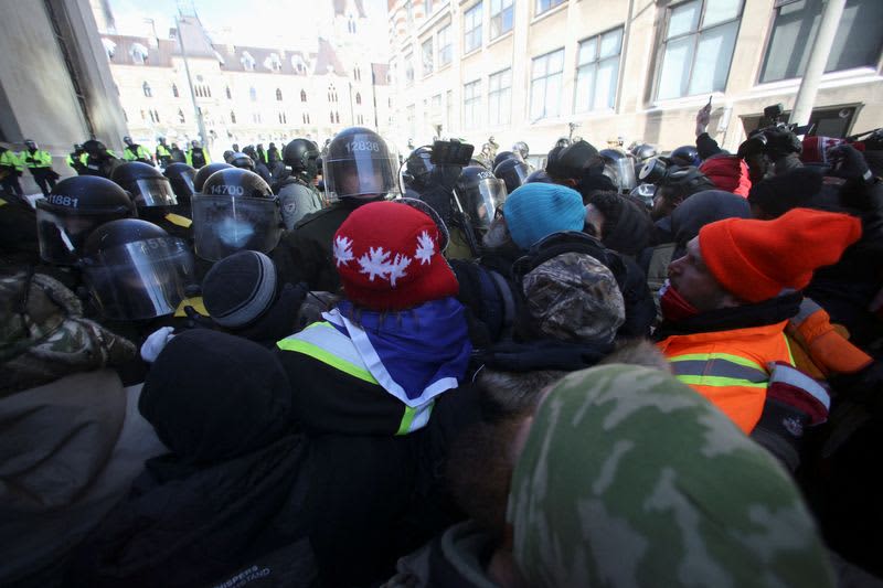 Canadian police arrest dozens to sweep protesters from parliament area 14 origin 1