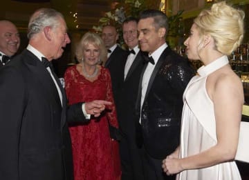 LONDON, ENGLAND - DECEMBER 06: Prince Charles, Prince of Wales and Camilla, Duchess of Cornwall greet Robbie Williams and Lady Gaga during the Royal Variety Performance at Eventim Apollo on December 6, 2016 in London, England. (Photo by Niklas...